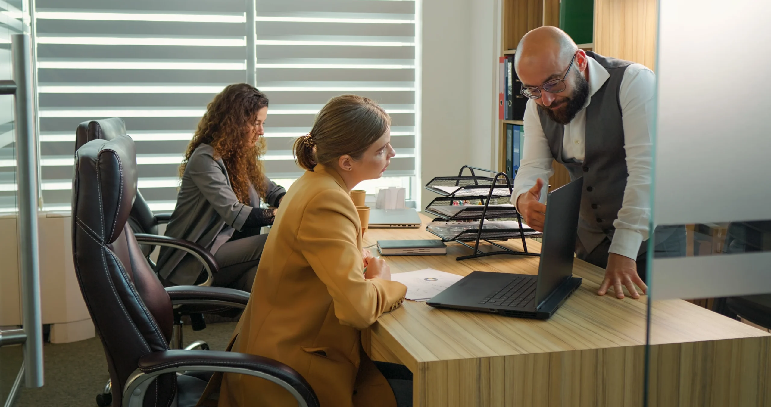 Two colleagues in a meeting at an office desk